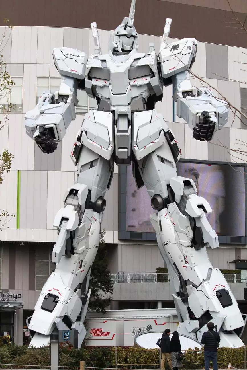 gray robot statue near building